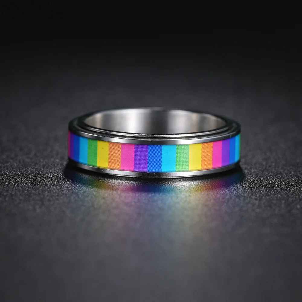bague anti stress arc-en-ciel main vertical