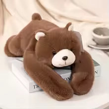 peluche lestee adulte ours sur ventre sur livre