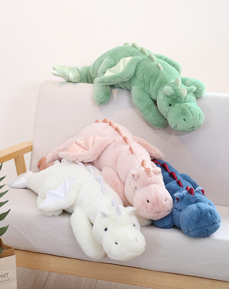 peluche lestee dragon 4 couleurs sur sofa