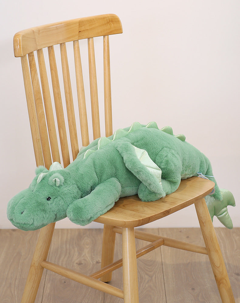 peluche-lestee-dragon-vert-sur-chaise